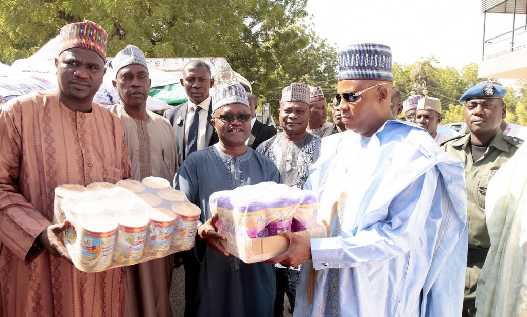 The governor recieving items for the IDPs from the Director General FRCN Dr. Ladan Salihu who led FRCN directors and staff to donate items to the IDPs in Maiduguri 