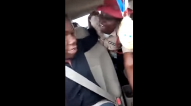 TRENDING VIDEO: FRSC officer struggles with driver of moving vehicle