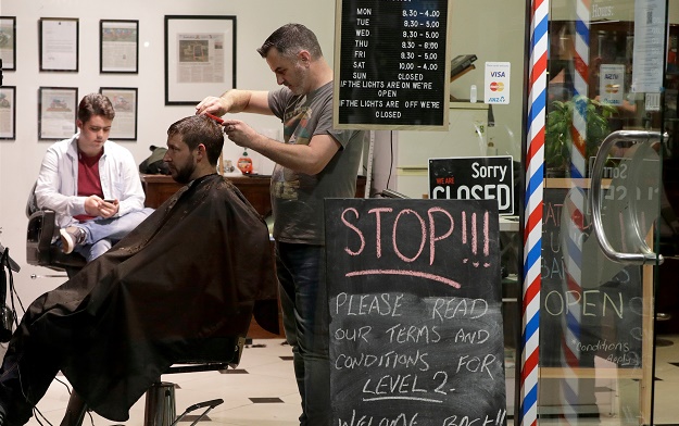 Midnight queues as New Zealand barbers reopen -- after 3 days with no new COVID-19 cases