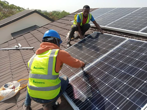 technicians imstalling solar panels