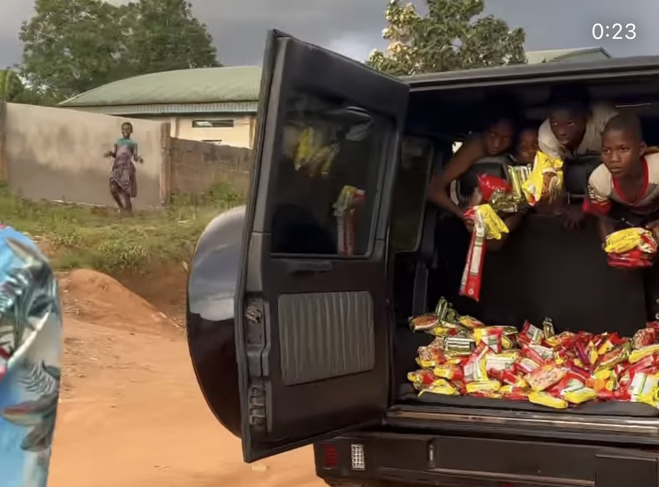 VIDEO: Portable uses G-Wagon to distribute food items to kids