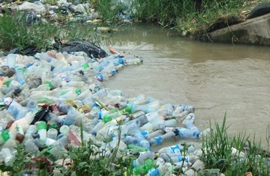 Plastic waste in a stream