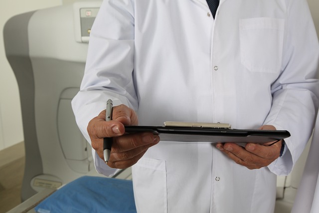 A doctor holding a patient file