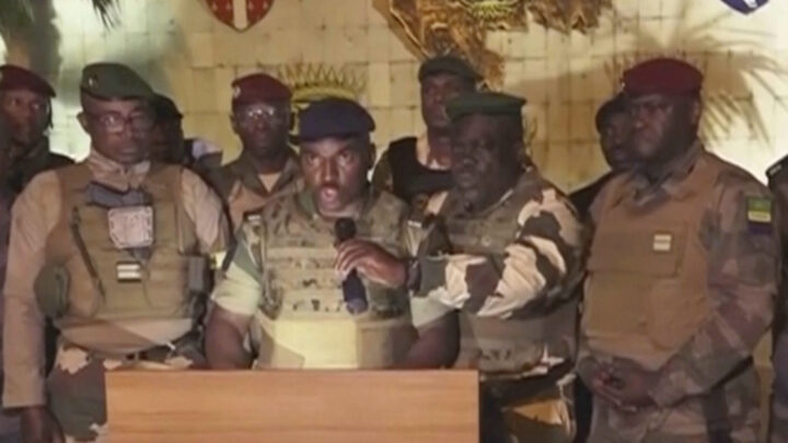 This video grab shoes the spokesperson for the mutinous soldiers speaking on state television as they announce that they had seized power in Libreville, Wednesday Aug. 30, 2023. Mutinous soldiers in Gabon said Wednesday they were overturning the results of a presidential election that was to extend the Bongo family's 55-year hold on power. (GABON 24 via AP)