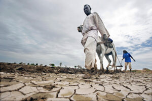 A farmer on a parched land in Darfur, Sudan