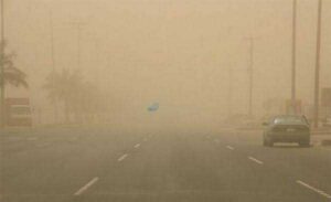 A road covered by a dust haze