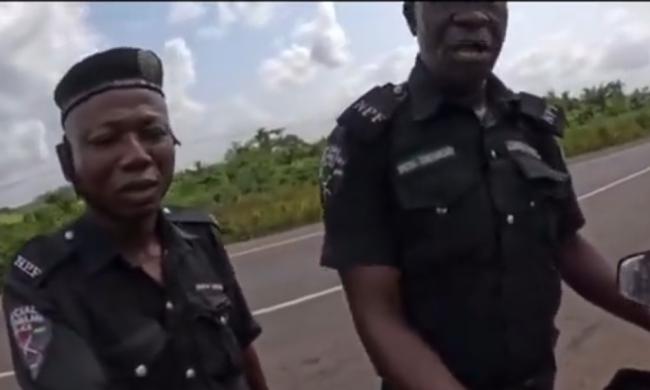 VIDEO: ‘Wetin you bring come’ — police officers ask Dutch lady riding bike to Abuja
