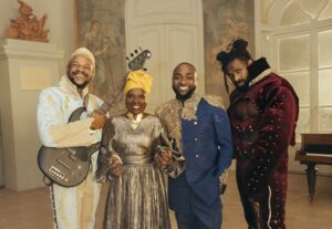 WATCH: Davido, Angelique Kidjo, The Cavemen join forces for 'Na Money' visuals