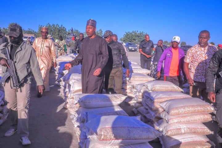 Prof. Babagana Zulum, governor of Borno state, shares food for flood victims