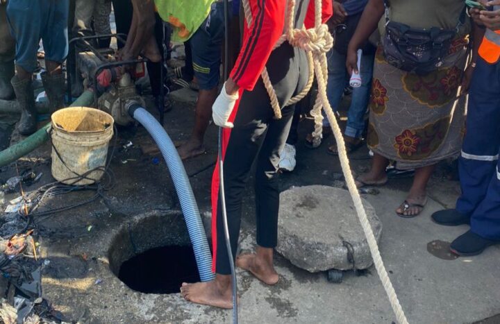 Rescue workers at an underground drainage in Lagos