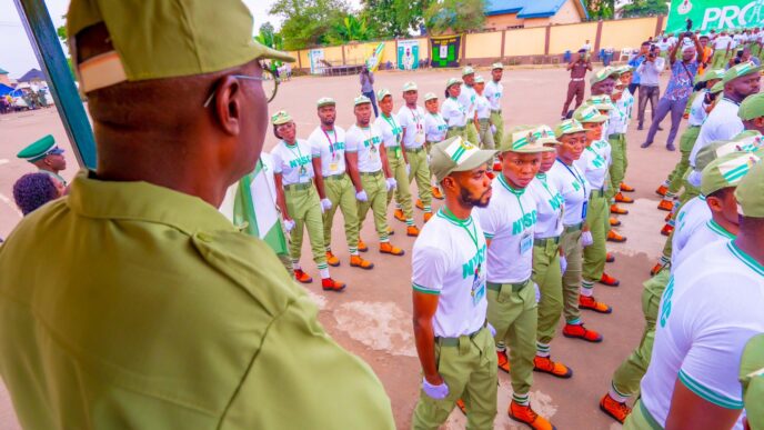 Sanwo-Olu (dressed in NYSC uniform, backing camera) at the Lagos orientation camp on Tuesday