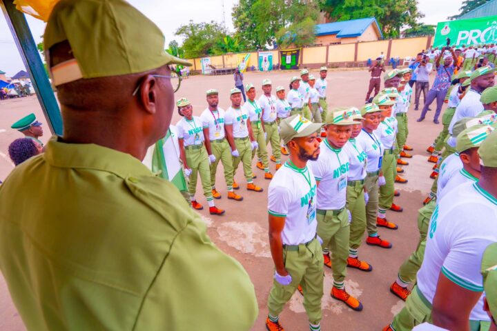 Sanwo-Olu (dressed in NYSC uniform, backing camera) at the Lagos orientation camp on Tuesday