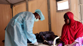 Doctor treating a child swith cholera