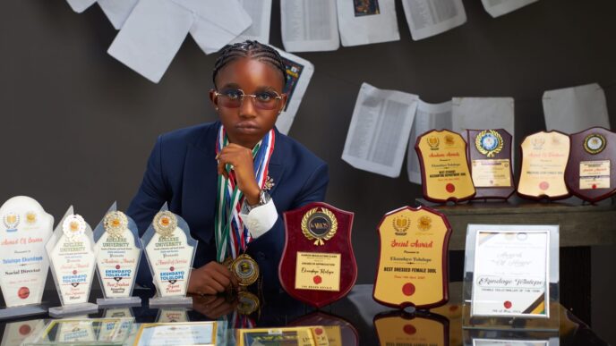 Tolulope Ekundayo, a 19-year-old graduate of Adeleke University, displays her awards