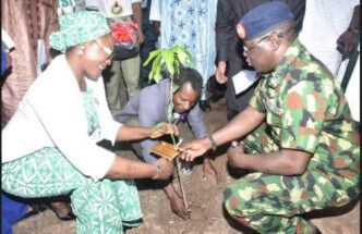 Jamila Bio-Ibrahim, minister for youth development, and YD Ahmed, the director-general of NYSC, planting a tree at the NYSC orientation camp in Keffi, Nasarawa State