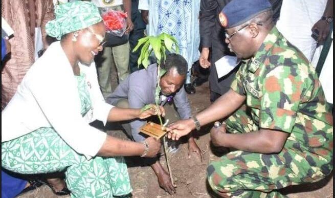 Jamila Bio-Ibrahim, minister for youth development, and YD Ahmed, the director-general of NYSC, planting a tree at the NYSC orientation camp in Keffi, Nasarawa State