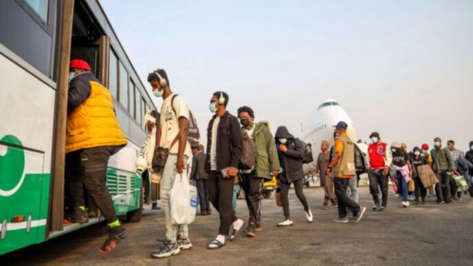 An illustrative image of young Nigerians enterting a tarmac shuttle.