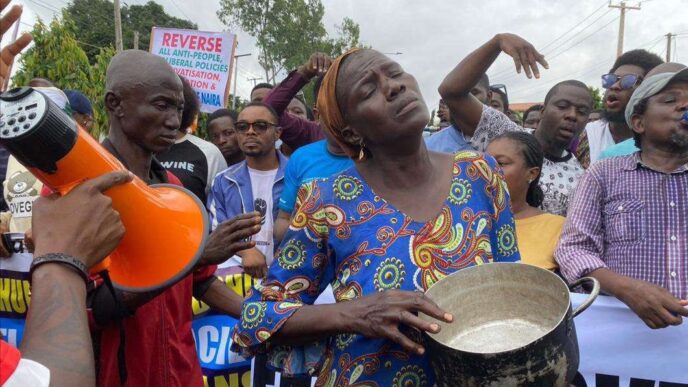 Viral photo of woman holding an empty pot at a protest ground in Lagos