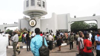 A photo of students thronging the University of Ibadan (UI) main gate.