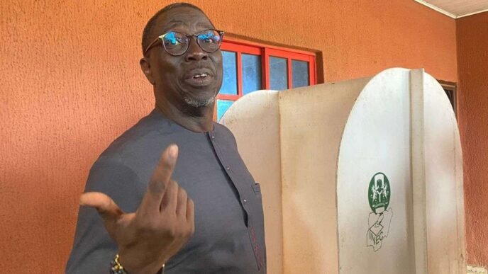 Asue Ighodalo, candidate of PDP, casts his vote