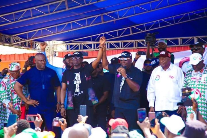 Godwin Obaseki, governor of Edo, presenting Asue Ighodalo, candidate of the PDP, to residents during a campaign rally