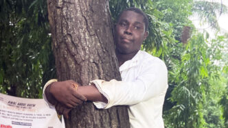 Abdul Hakim Awal, the 23-year-old journalist from Kumasi, Ghana, has broken the world record for the longest time to hug a tree