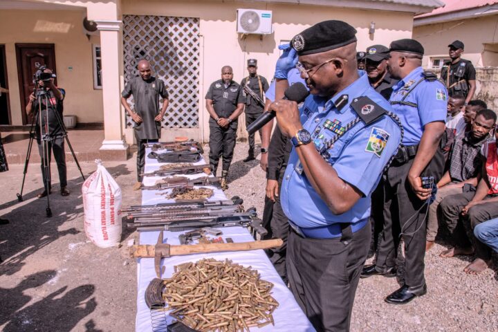 Police displaying weapons after 'arresting arms dealer' in Plateau