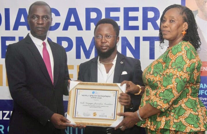 Taiwo Adebulu, CNJF's investigations editor (middle) receiving the award from Otufodunrin (left) and Ugonma Cokey, member, board of trustees, Media Career Development Network (right)