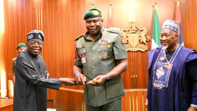 President Bola Tinubu and Olufemi Oluyede