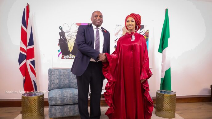 David Lammy, UK foreign secretary in a hand shake with Hannatu Musawa, Nigeria’s minister of art, culture and creative economy