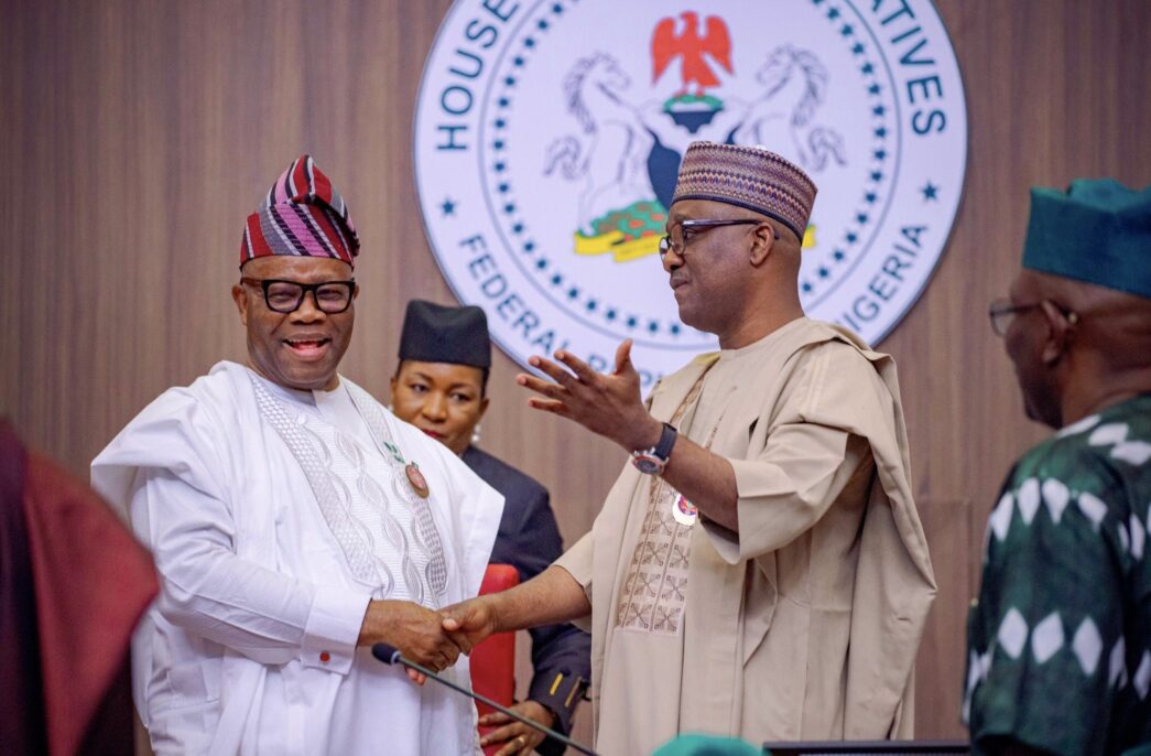 Godswill Akpabio, president of the senate, and Tajudeen Abbas, speaker of the house of representatives, exchange pleasantries during the 2025 budget presentation at the national assembly