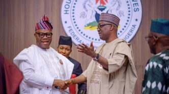 Godswill Akpabio, president of the senate, and Tajudeen Abbas, speaker of the house of representatives, exchange pleasantries during the 2025 budget presentation at the national assembly