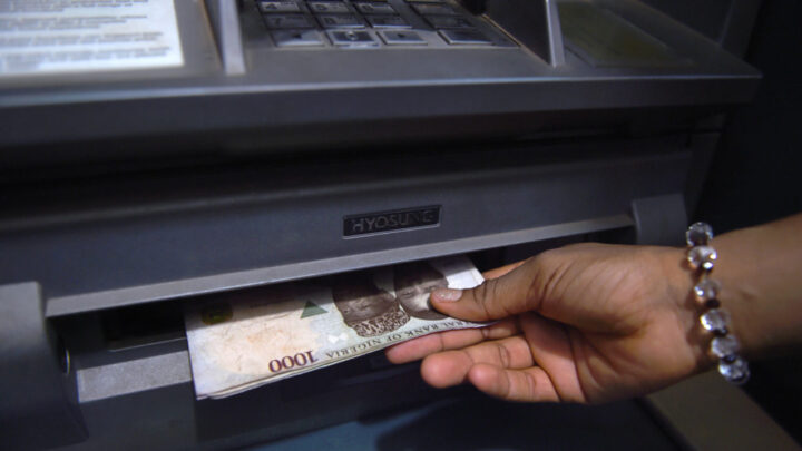 File photo of cash withdrawal from an ATM for business