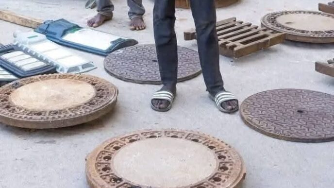 Abuja police officers apprehend suspects stealing manhole covers