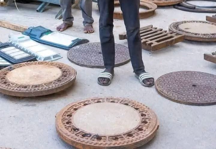 Abuja police officers apprehend suspects stealing manhole covers