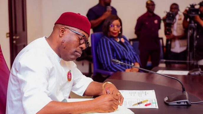 Siminalayi Fubara, governor of Rivers state, signing the 2025 budget into law