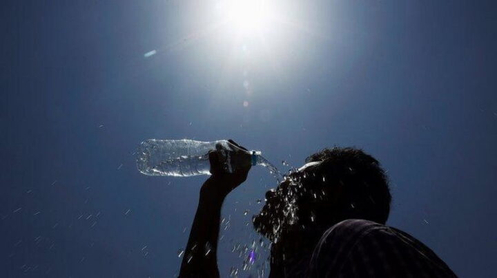 Man cools off amid heatwave. Photo credit: Nairametrics